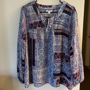 Gorgeous sheer medium top. This blue and pink top is perfect for work or play.